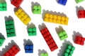 Bright multicolored children`s toy constructor on a white isolated background, texture Royalty Free Stock Photo