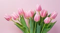 heap of tulips on pink pastel color background with copy space