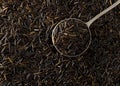 Heap of uncooked, raw, black wild rice grains in metal scoop on rice grain background, flat lay top view from above Royalty Free Stock Photo