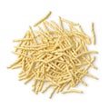 Heap of uncooked talian trofie pasta close up on white background