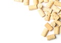 Heap of unused, new, brown natural wine corks on white background, flat lay top view