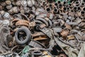 Heap of used rust auto parts in scarp yard.