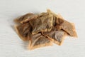 Heap of used tea bags on white wooden table Royalty Free Stock Photo