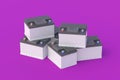 Heap of 12 V auto batteries on purple background. Battery capacity