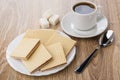 Heap of waffles in white plate, lumpy sugar, black coffee Royalty Free Stock Photo