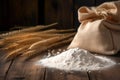 Heap of wheat flour next to ears of wheat on a wooden background. Barley flour in a paper bag on old wooden floor. Generative AI Royalty Free Stock Photo