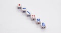 Heap of white cubic dice with blue and red spikes dots on a white background. Royalty Free Stock Photo