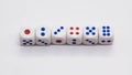 Heap of white cubic tree six dices with blue and red spikes dots on a white background. Royalty Free Stock Photo