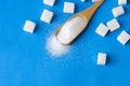 Heap of white granulated sugar with sugar cube Royalty Free Stock Photo