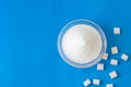 Heap of white granulated sugar with sugar cube Royalty Free Stock Photo