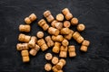 Heap of wine bottle corks on black background top view Royalty Free Stock Photo