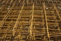 A heap of wiremesh steel covering by rust on the cocrete floor in front the building in construction Royalty Free Stock Photo