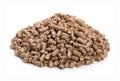 Heap of woody clumps, pellets of litter, for cat, rabbit, guinea pig, hamster, rodent, bird, turtle and other pets, isolated on a Royalty Free Stock Photo