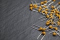 Heap of yellow multilayer ceramic capacitors Royalty Free Stock Photo