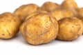 Heap of young potatos isolated on white background