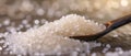 Heaping spoonful of white granulated sugar against a sparkling background, indicating sweetness and dietary concerns Royalty Free Stock Photo