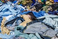 Heaps of clothing on the second hand market Royalty Free Stock Photo
