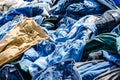 Heaps of clothing on the second hand market Royalty Free Stock Photo