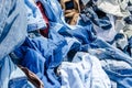 Heaps of clothing on the second hand market Royalty Free Stock Photo