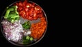 Heaps of different cut vegetables isolated on black background. Royalty Free Stock Photo