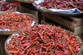 Heaps of dried chilies in baskets