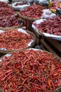 Heaps of dried chilies in baskets