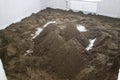 Heaps of dry sand and concrete mix for leveling the floor in a newly built room Royalty Free Stock Photo