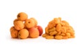 Heaps of fresh and dried apricots isolated on white