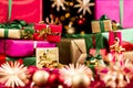 Heaps of Little Xmas Gifts Between Straw Stars Royalty Free Stock Photo