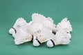 Heaps of used and worn out badminton shuttlecock on green cour Royalty Free Stock Photo