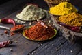 Heaps of various ground spices on wooden background. Georgian spices, Indian spices, Arabian spices. Spice variety. Herbs and spic Royalty Free Stock Photo