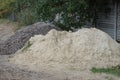 Heaps of white sand and gray rubble