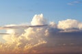 Heapy clouds with warm sunset`s ray. Royalty Free Stock Photo