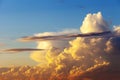 Heapy clouds with warm sunset`s ray. Royalty Free Stock Photo