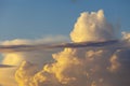 Heapy clouds with warm sunset`s ray. Royalty Free Stock Photo