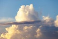 Heapy clouds with warm sunset`s ray. Royalty Free Stock Photo