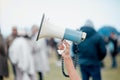 Hear our rage Mr President. Cape Town, South African - October 2, 2021 An unrecognisable demonstrator holding up a