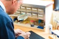 Acoustician working on a hearing aid