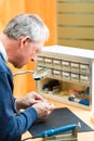 Acoustician working on a hearing aid