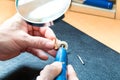 Acoustician working on a hearing aid