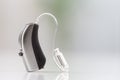 Hearing aid on a gray background Royalty Free Stock Photo