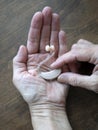 Hearing aid in hand. Assistive listening or alerting devices. World hearing day