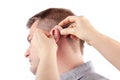 Hearing aid inserting Royalty Free Stock Photo