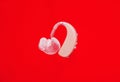 Hearing aid on red