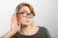 Shocked girl eavesdropping. Royalty Free Stock Photo