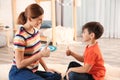 Hearing impaired mother and her child talking with help of sign language