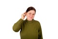 Hearing impaired woman inserting her hearing aid