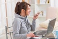 Hearing impaired woman working with laptop