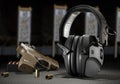 Hearing protection with ammo and a pistol Royalty Free Stock Photo