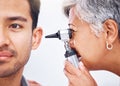 Hearing test, doctor and patient with healthcare consultation closeup, face and ENT specialist with otoscope. Medical